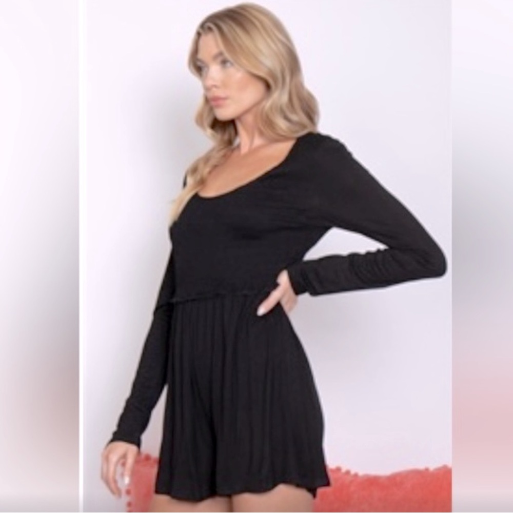 128. NWT New in black romper cut out back long sleeves